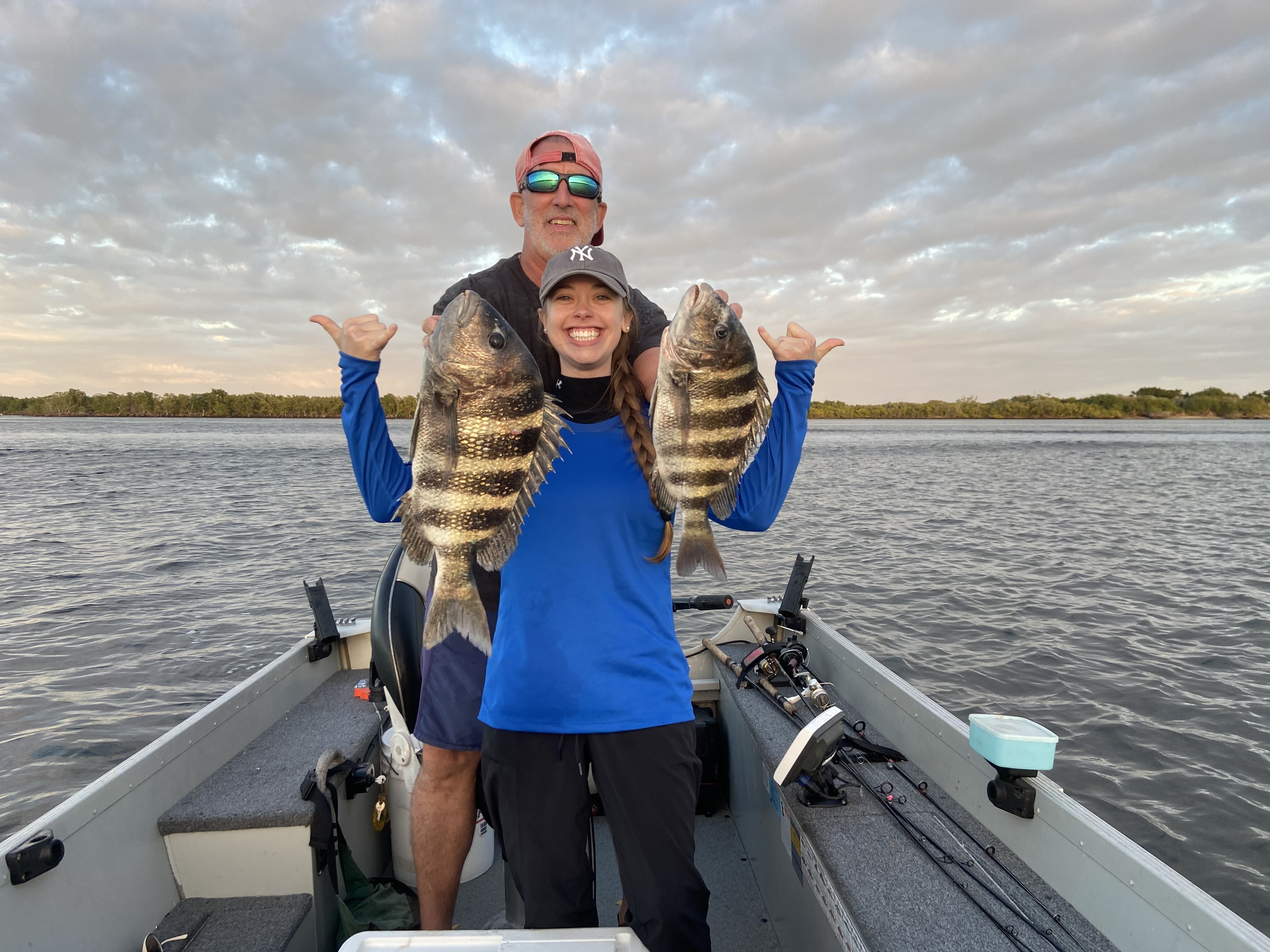Angler casting on a scenic lake - Angler's Edge Hero